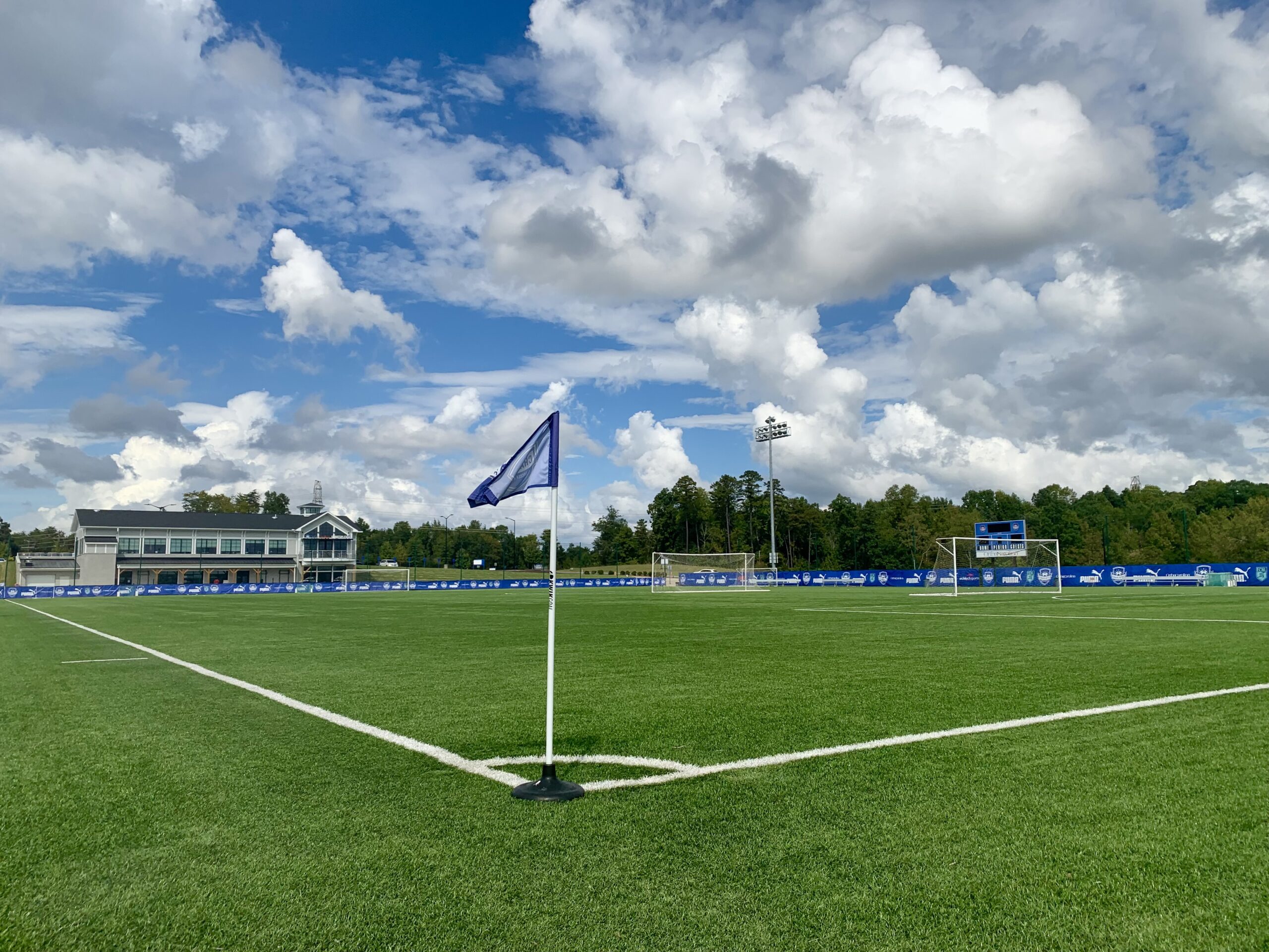 Corner flag view of field 2 and office building in distance